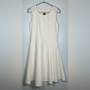 Ann Taylor Cream Sleeveless Dress. Exquisite design in the back. Size 8.